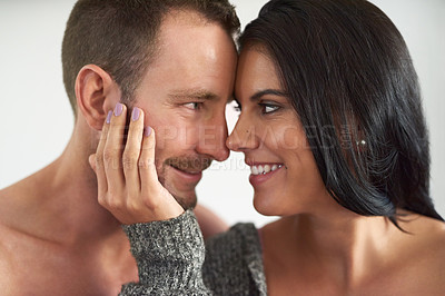 Buy stock photo Cropped shot of an affectionate young couple about to kiss at home