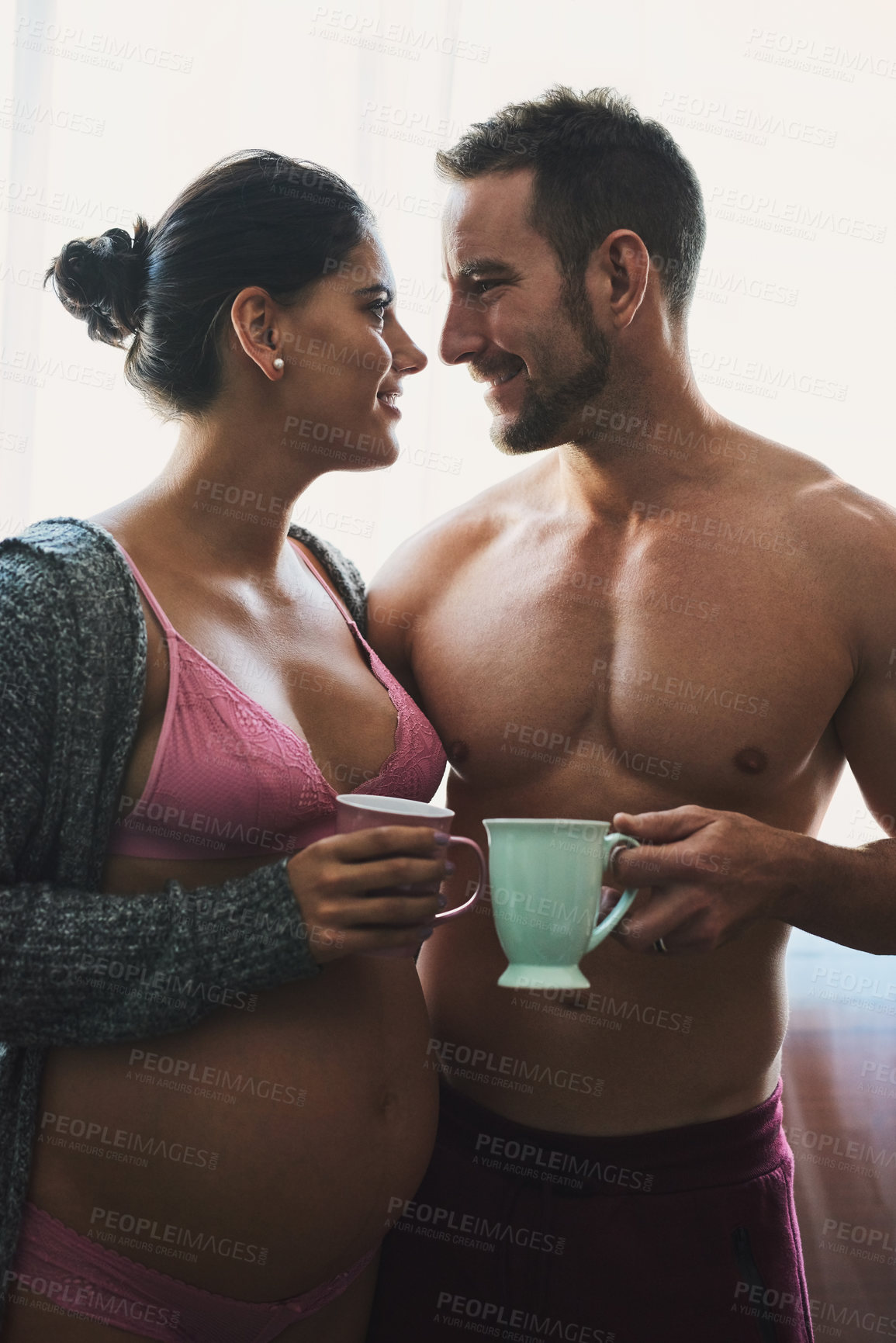 Buy stock photo Man, pregnant woman and coffee break in bedroom for prenatal care, bonding and love of pregnancy development. Couple, wife and stomach with underwear, healthy maternity and together at house