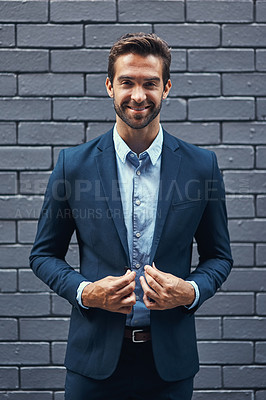 Buy stock photo Portrait businessman, suit and brick wall in city of Spain for corporate success, professional goals and expert management. Happy young manager, ceo and boss standing against urban background outdoor