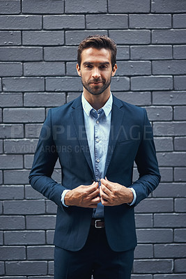 Buy stock photo Male model, portrait and bricks for fashion with confidence in suit, clothing or trendy and cool. Businessman, backdrop or professional and stylish for career with corporate, lawyer with style in USA