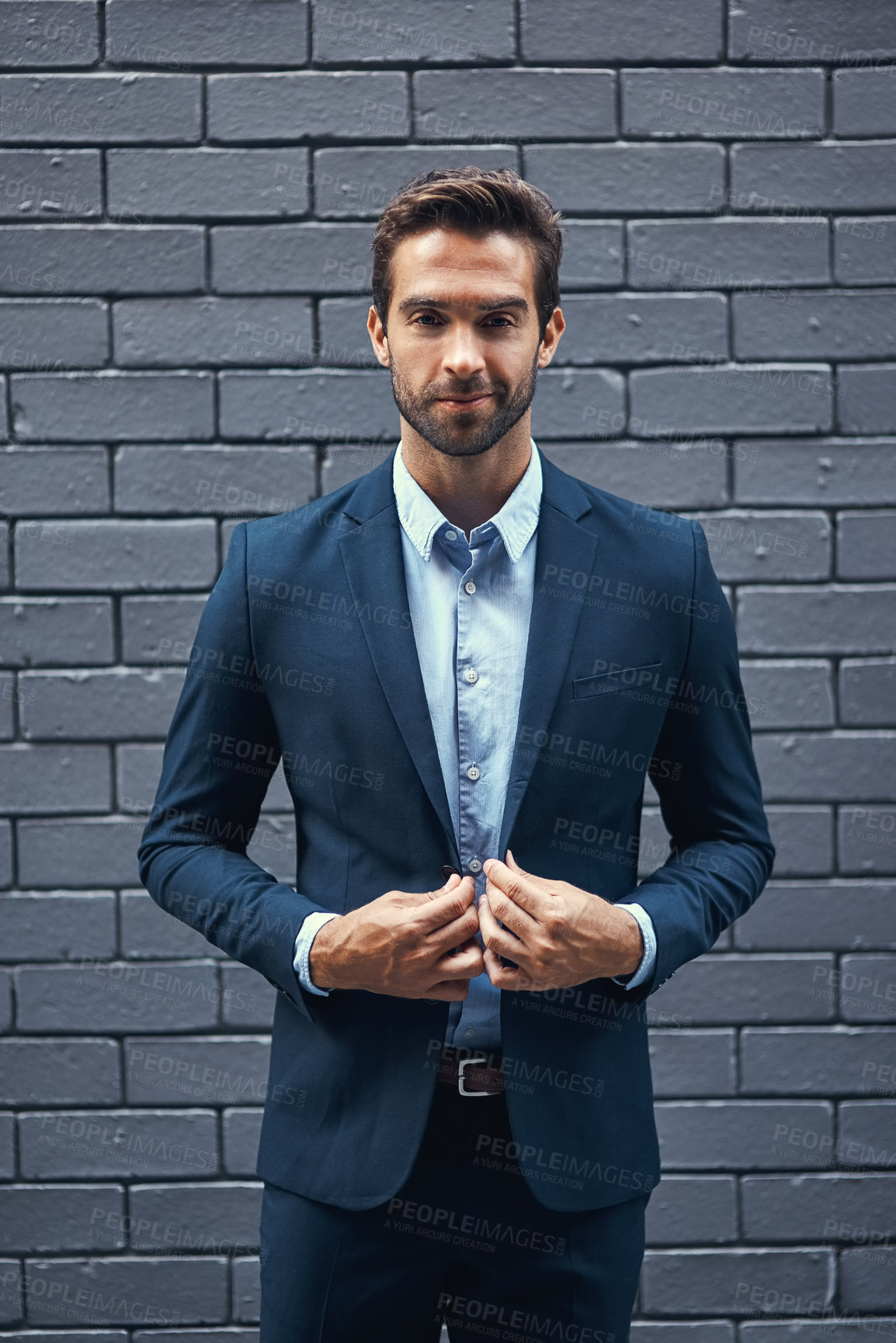 Buy stock photo Male model, portrait and bricks for fashion with confidence in suit, clothing or trendy and cool. Businessman, backdrop or professional and stylish for career with corporate, lawyer with style in USA