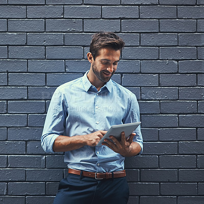 Buy stock photo Happy business man, tablet and research online, reading email or info on wall background space in city. Smile, digital tech and professional on website, app and financial agent networking on internet