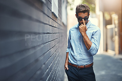 Buy stock photo Business, portrait and man in street with sunglasses, confidence and office fashion for opportunity. Brick wall, urban professional and businessman with trendy style, pride and startup career in city