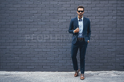 Buy stock photo Lawyer, man and wall in suit with sunglasses for fashion, style and mockup space in outdoor. Male person, pride and confidence in street for work, corporate or career in grey background in Berlin
