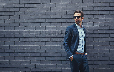 Buy stock photo Fashion, suit and man with glasses for confidence, trendy clothes and professional style. Male person, eyewear and gentleman with pose by grey background for classy outfit, elegance and mockup
