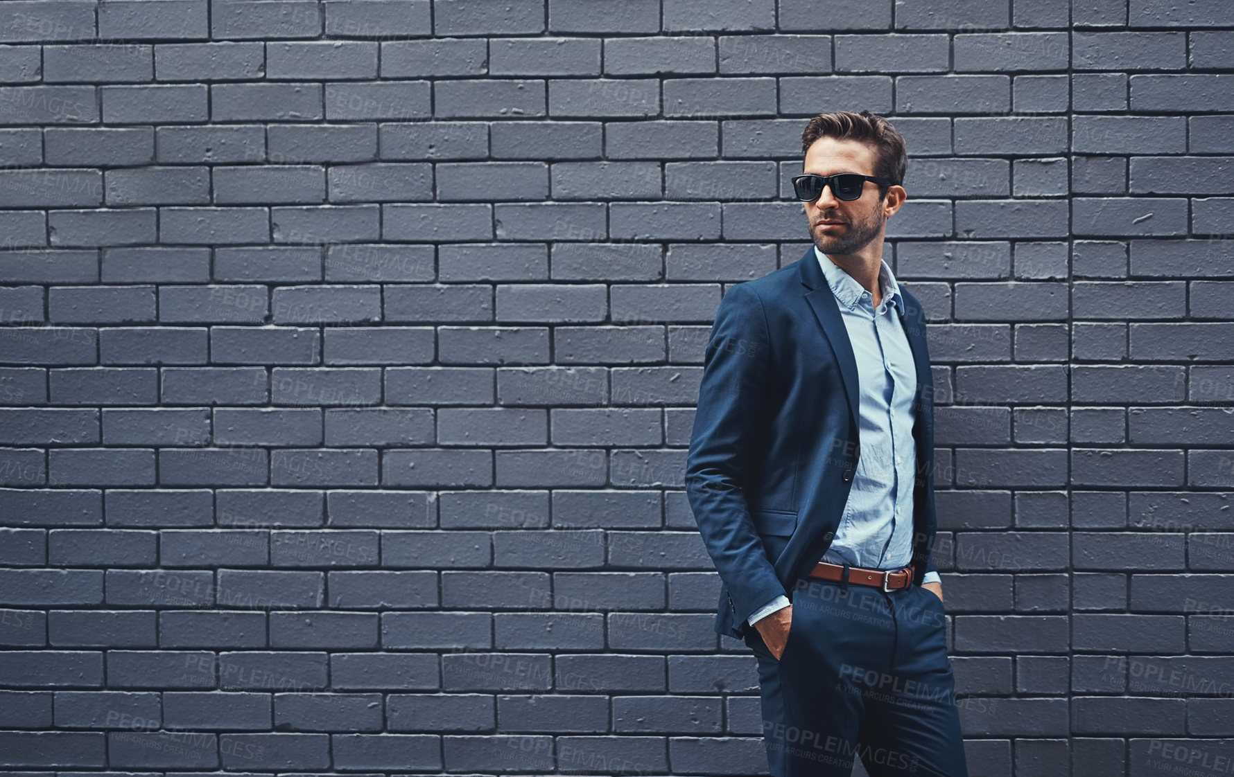 Buy stock photo Fashion, suit and man with glasses for confidence, trendy clothes and professional style. Male person, eyewear and gentleman with pose by grey background for classy outfit, elegance and mockup