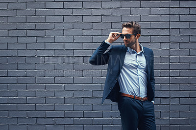 Buy stock photo Suit, sunglasses and man with thinking by wall for fashion, trendy style and professional clothes. Gentleman, eyewear and person by grey background with elegance, classy outfit and confidence