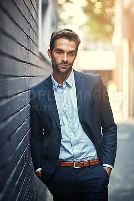 Buy stock photo Confident, businessman and portrait in city by wall for corporate fashion, trendy and stylish suit. Male entrepreneur, professional and happy in street for travel to work or company and outdoor.