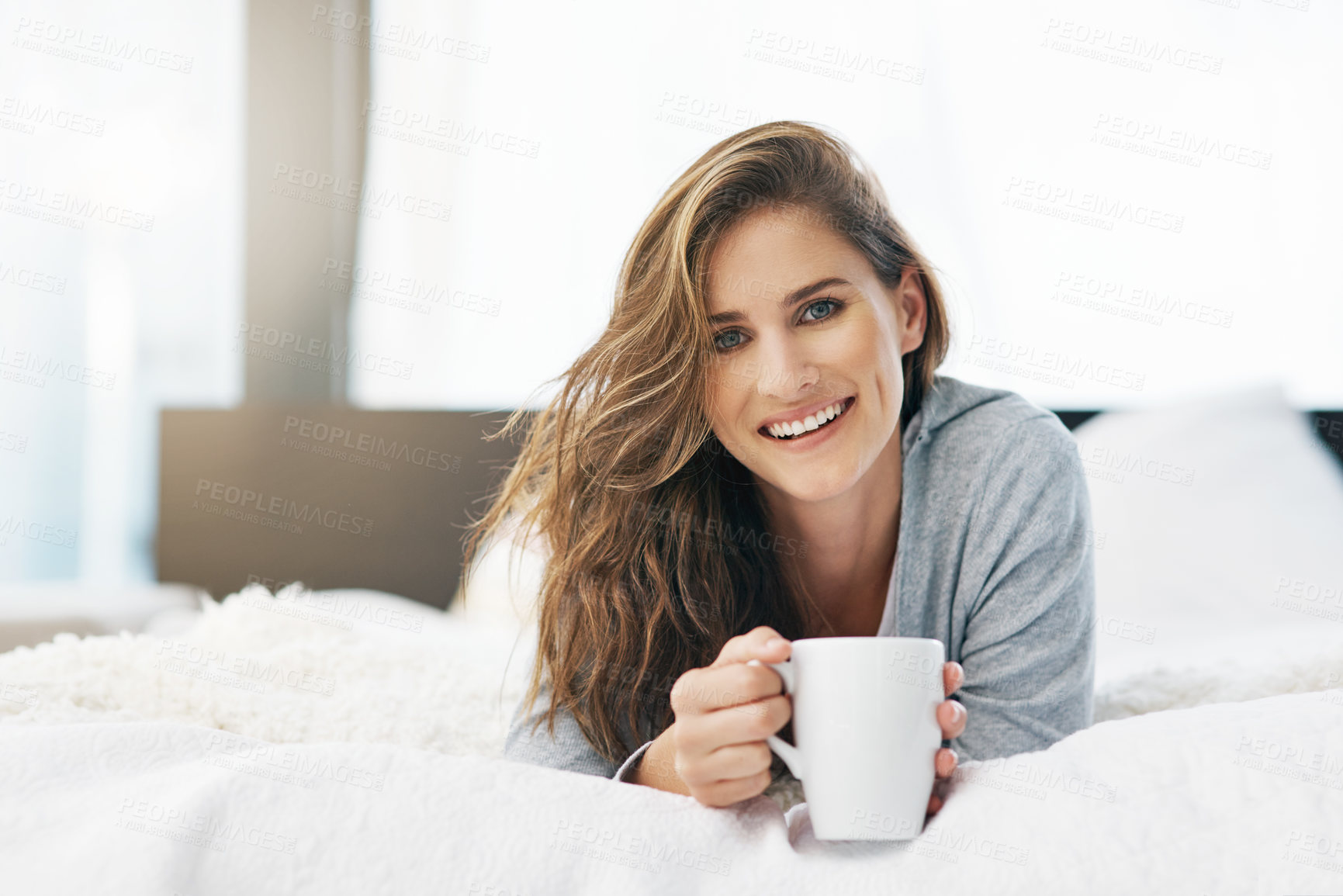 Buy stock photo Woman, portrait and relax on bed for tea for weekend break, peace or wellness in apartment or home. Wake up, morning or happy person resting on bedroom or day off drinking coffee or beverage