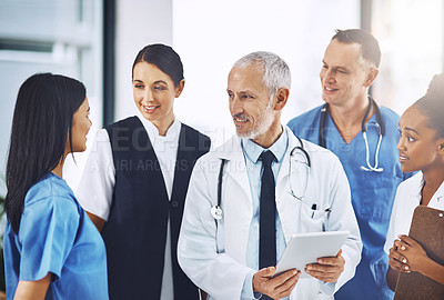 Buy stock photo Senior man, team or group of doctors with tablet, smile or leadership for discussion, planning or together in hospital. Medical men, leader and experience for teamwork, women or touchscreen in clinic