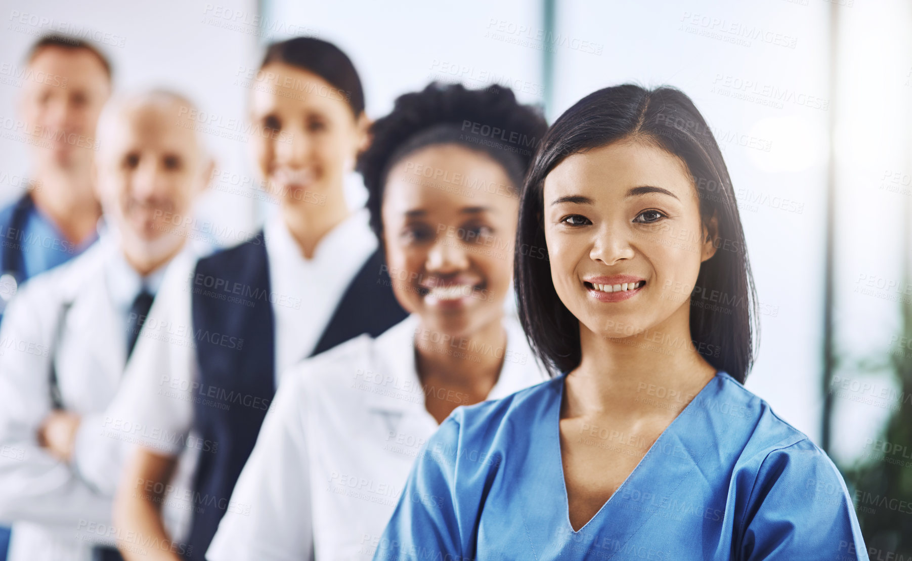 Buy stock photo Team, happy woman leader and portrait of doctors and nurses in hospital, teamwork and healthcare. Health, diversity and medicine, confident doctor and group of medical employees in row with smile.