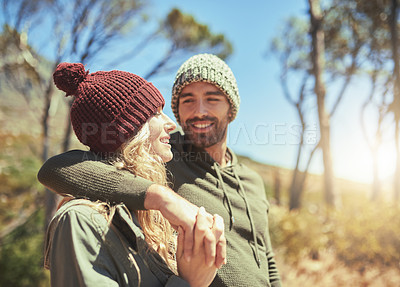Buy stock photo Shot of young people hiking through a wilderness area
