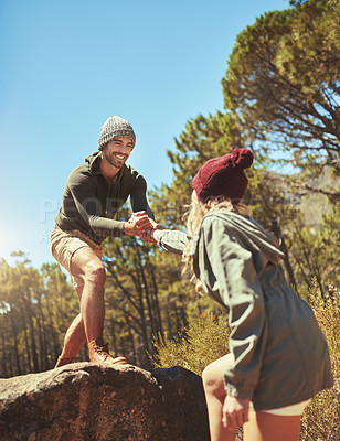 Buy stock photo Climbing, helping hands and man for hiker couple outdoor in mountains together for exercise or hobby. Challenge, hiking and teamwork with people in nature for adventure, fitness or weekend workout
