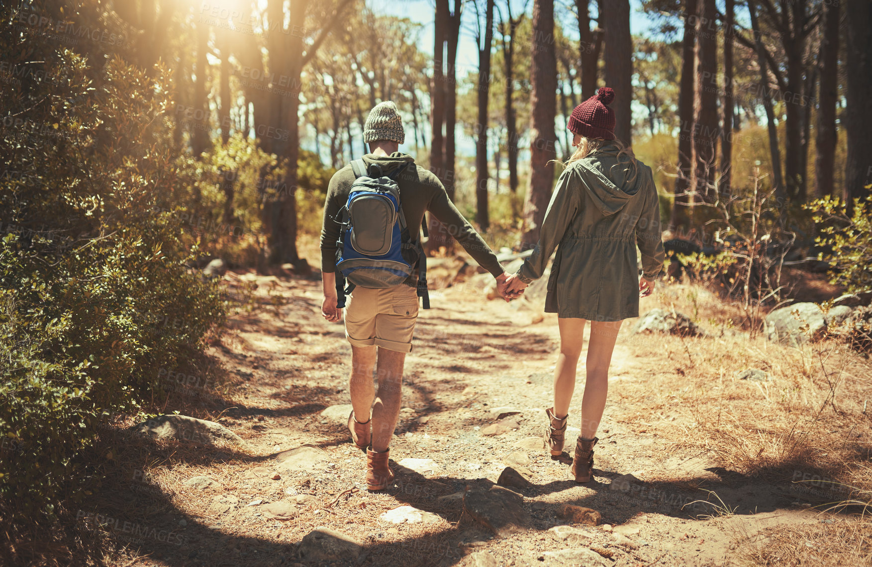 Buy stock photo Back, couple and hiking by holding hands outdoor with backpack, trekking path and travel adventure in nature. People, support and walking for fitness, health bonding and cardio together in forest