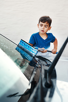 Buy stock photo Child, car and cleaning window with soap as household chore for responsibility, independence or task. Boy, transport and washing windshield outdoor as pocket money to do list, learning or discipline