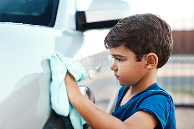 Buy stock photo Child, car wash and cleaning or outdoor learning as youth chores for to do list, responsibility or discipline. Boy, cloth and vehicle outside for daily task or household helping, independence or duty
