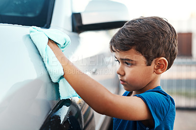 Buy stock photo Child, car and cleaning with cloth outdoor for youth responsibility or discipline, chores or shining. Boy, vehicle and polish activity for household to do list for helping task, service or learning