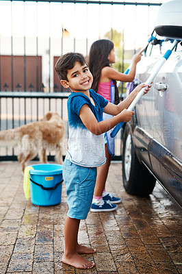 Buy stock photo Children, portrait and home and washing car, kids and cleaning motor vehicle with equipment for fun. Siblings, driveway and helping with responsibility together on weekend, happy in outdoor for chore