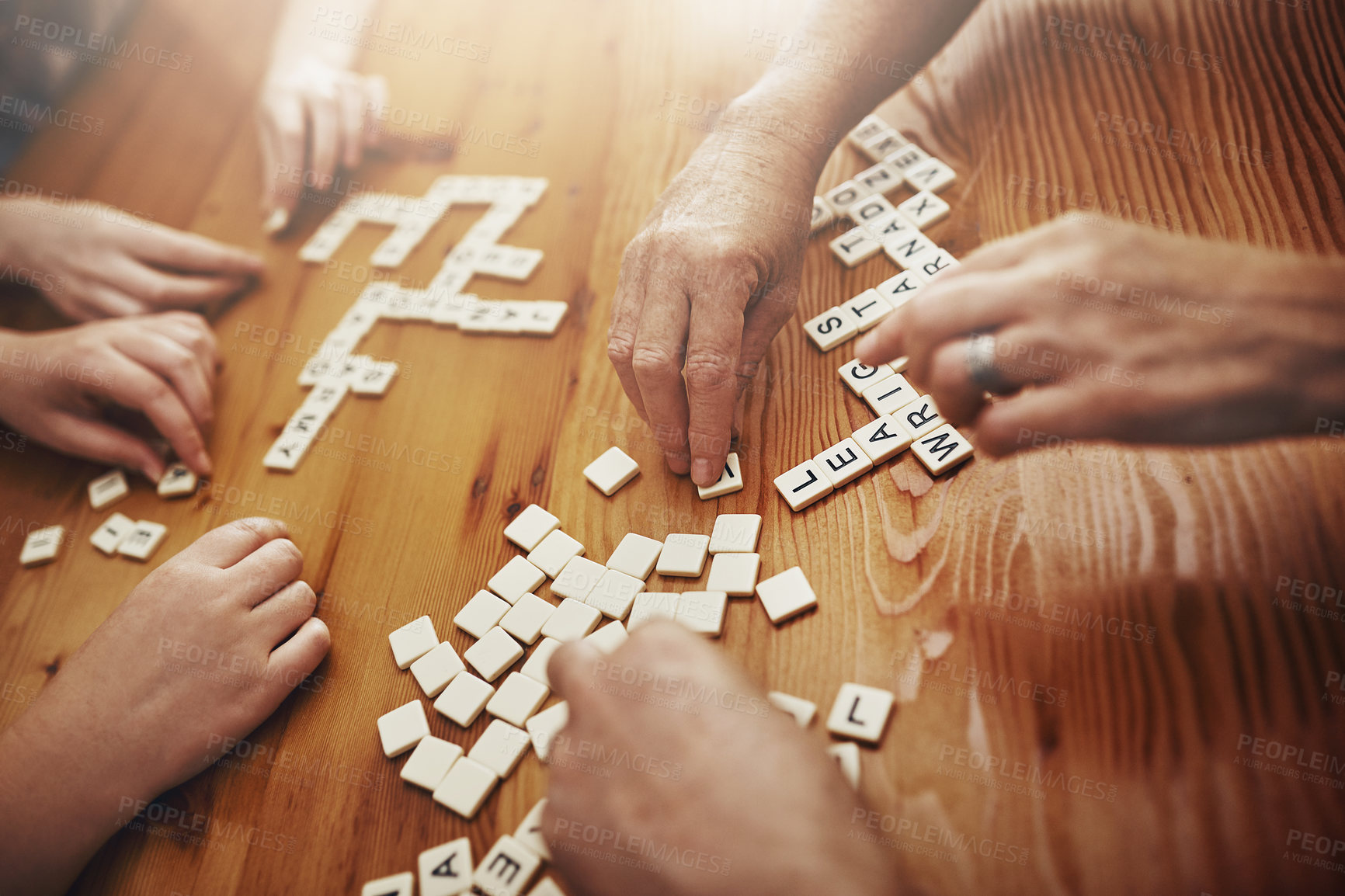 Buy stock photo Shot of a group of people playing a word game together