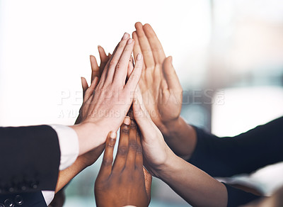 Buy stock photo Business people giving high five for motivation, unity, and support in a meeting together at work. Closeup of hands of colleagues and employees huddling to celebrate a success, victory or win
