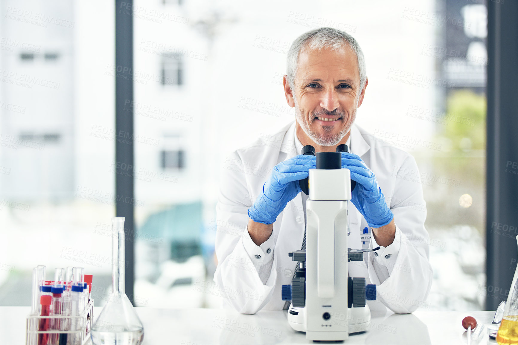 Buy stock photo Happy man, microscope and portrait of scientist in forensic science, breakthrough or discovery at laboratory. Male person, medical or healthcare professional with smile in scientific research at lab