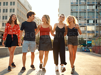 Buy stock photo Group, people and walking in city for street fashion or style with solidarity, unity and outdoor. Friends, trendy and together for happiness, freedom and bonding on weekend as gen z or students in UK