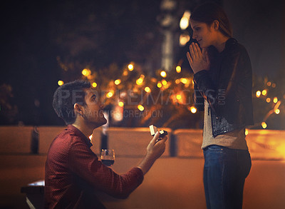 Buy stock photo Shot of a young man going on his knees during his proposal