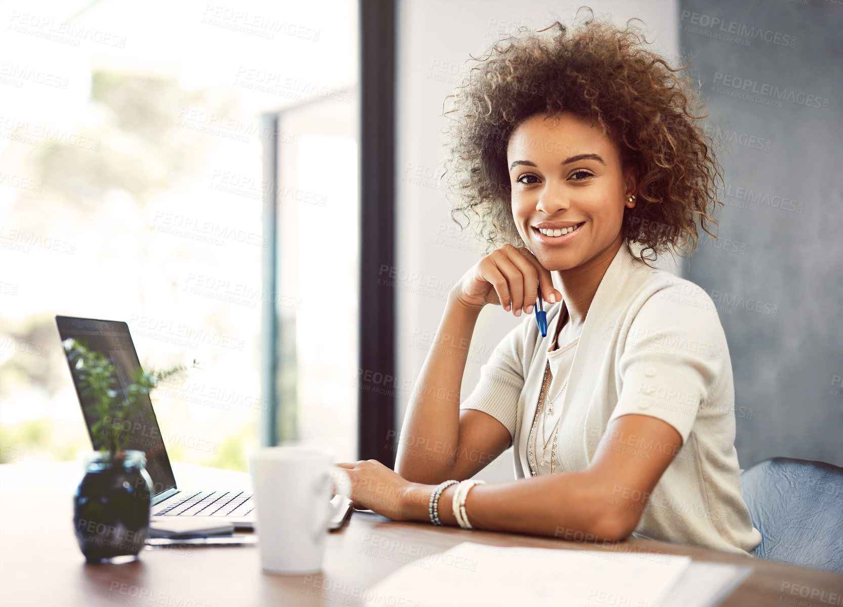 Buy stock photo Cropped portrait of an attractive young businesswoman working on her laptop at home