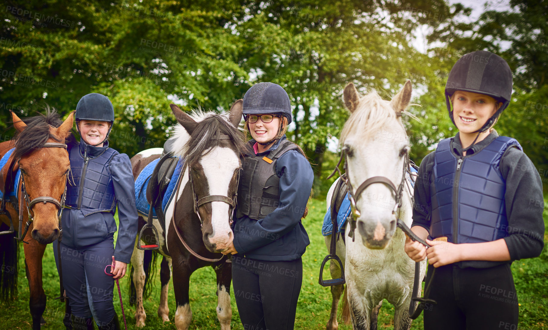 Buy stock photo Shot of a group of teenage girls going horseback riding together