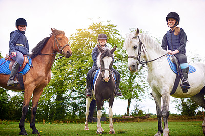 Buy stock photo Shot of a group of teenage girls going horseback riding together