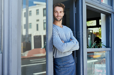 Buy stock photo Door, crossed arms and portrait of barista by coffee shop with positive, happy and confident attitude. Smile, pride and man waiter standing by cafe or restaurant entrance for welcome in hospitality.