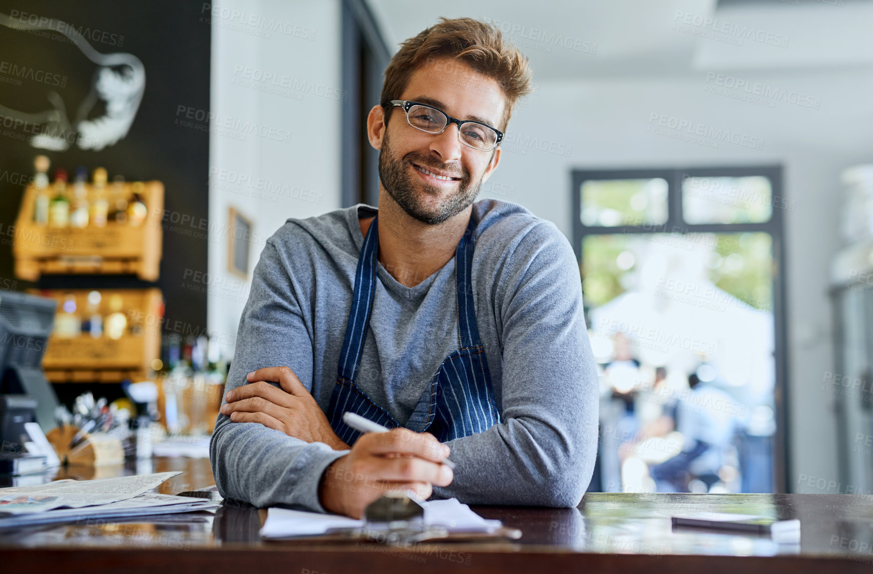 Buy stock photo Happy businessman or coffee shop owner with documents or agenda for planning menu and recipes in cafe. Male entrepreneur, paperwork and smile for research, ideas and budget review in restaurant 