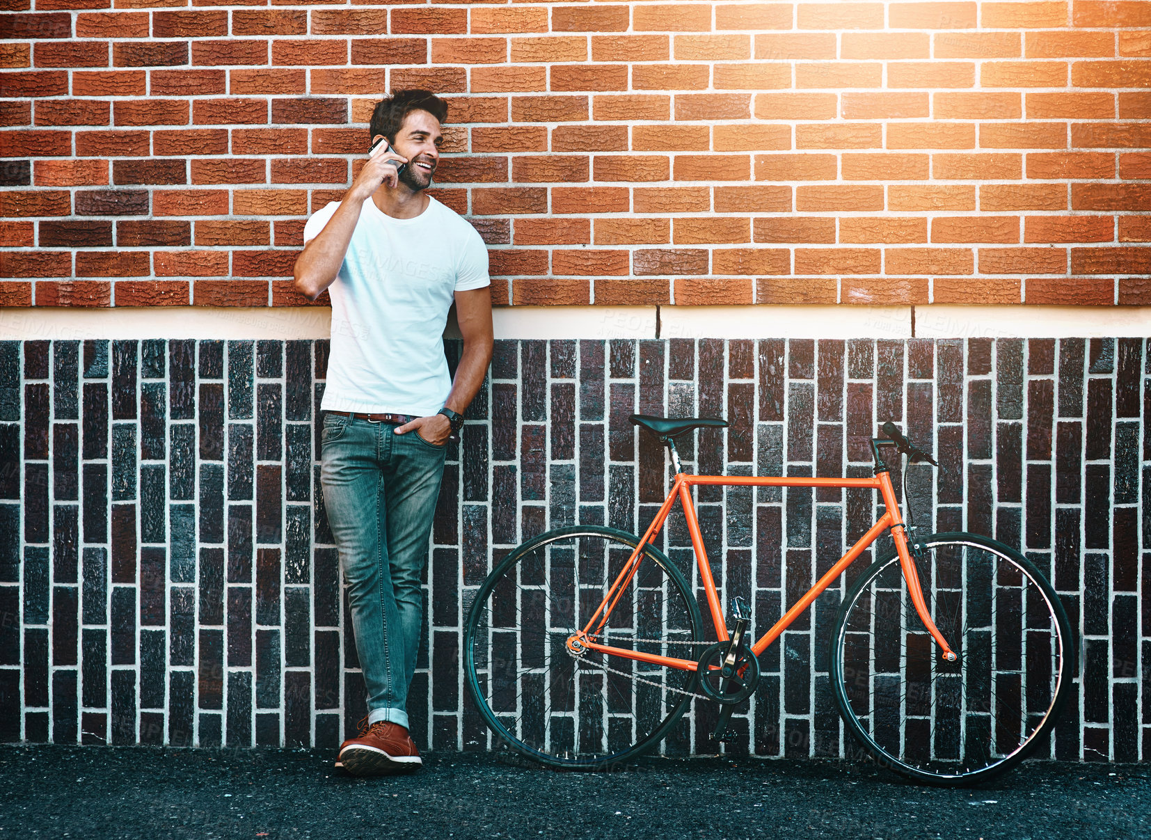 Buy stock photo Happy, bike and man in city, phone call for mobile communication and urban active lifestyle. Person, smartphone and bicycle for eco friendly transport, conversation and connection for travel plans