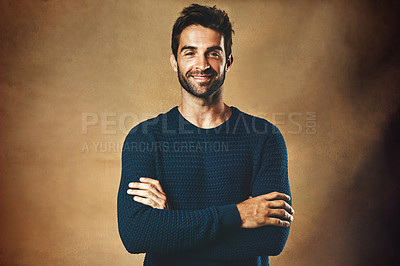 Buy stock photo Portrait, man and fashion in studio for confidence for modeling, designer brand and hipster style. Handsome face, smile and model by brown background for winter clothes, cool hair and casting agency