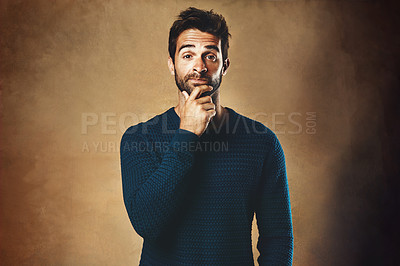 Buy stock photo Portrait, thinking and man in studio, fashion and warm in winter, confidence and sweater for aesthetic. Wondering, wall background and person or model, cool and trendy with clothes, stylish or jersey