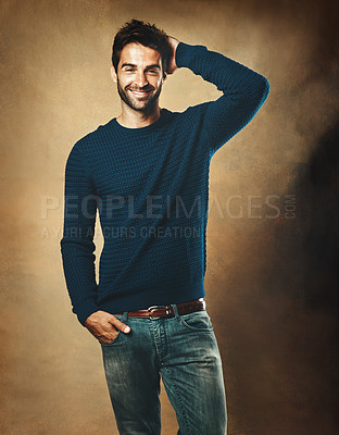 Buy stock photo Portrait, proud and man in studio, sweater and warm in winter, confidence and fashion for aesthetic. Smile, person and background of wall, model and cool with trend, stylish and jersey for clothes
