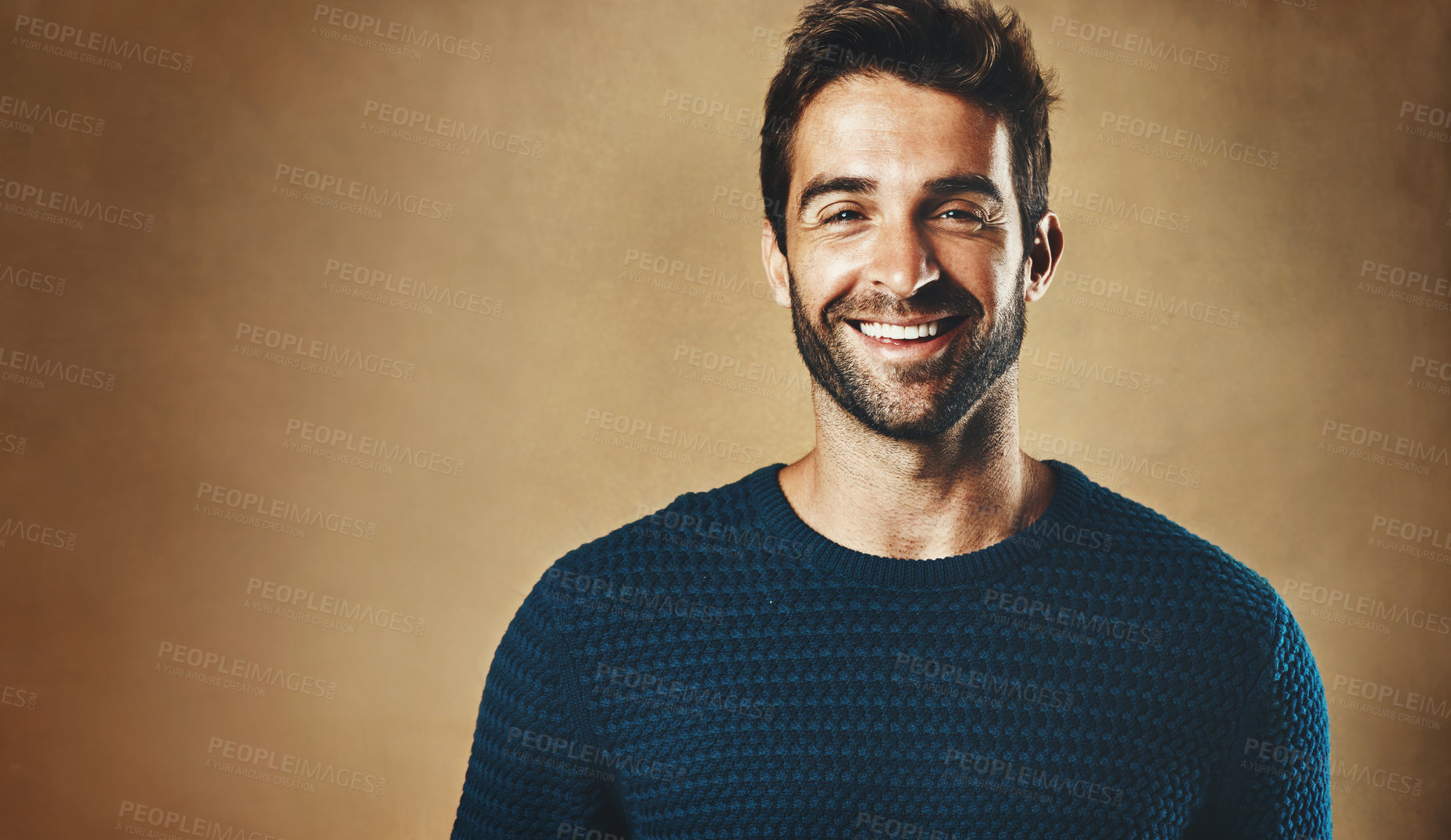 Buy stock photo Smile, portrait and man with clothes for fashion, style and casual wear isolated on brown background. Face, happy or model with trendy sweater, closeup and cool person in studio backdrop with mockup