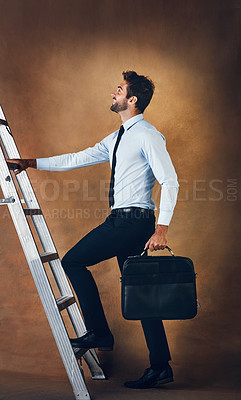 Buy stock photo Businessman, climbing and corporate ladder in studio for work opportunity, promotion and goal. Confident, male person and entrepreneur with suitcase for creative skill, responsibility and future