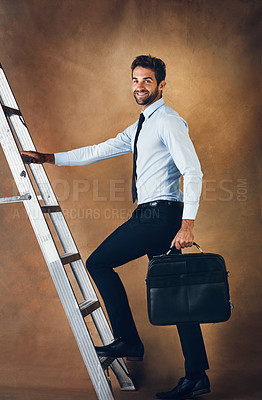 Buy stock photo Male person, climbing and corporate ladder in studio for work opportunity, promotion and high salary. Confident, man  and entrepreneur with suitcase for trip to skill, responsibility and goals