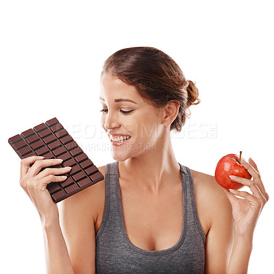 Buy stock photo Woman, chocolate and apple with decision for balance, weight loss and snack comparison for diet on white background. Nutrition, fruit and candy with unhealthy versus healthy food, benefits and choice