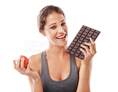 Buy stock photo Woman, chocolate and apple with comparison in portrait, weight loss and balance with snacks on white background. Nutrition, fruit and candy with unhealthy versus healthy food, benefits and choice