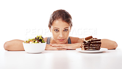 Buy stock photo Portrait, food and choice with a woman in studio on a white background to decide between a salad or cake. Diet, nutrition or health with a chocolate dessert and a healthy bowl of fresh vegetables
