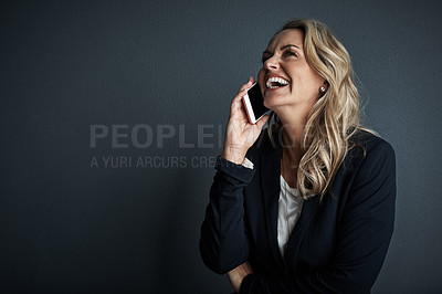 Buy stock photo Studio shot of a mature businesswoman talking on a cellphone against a grey background