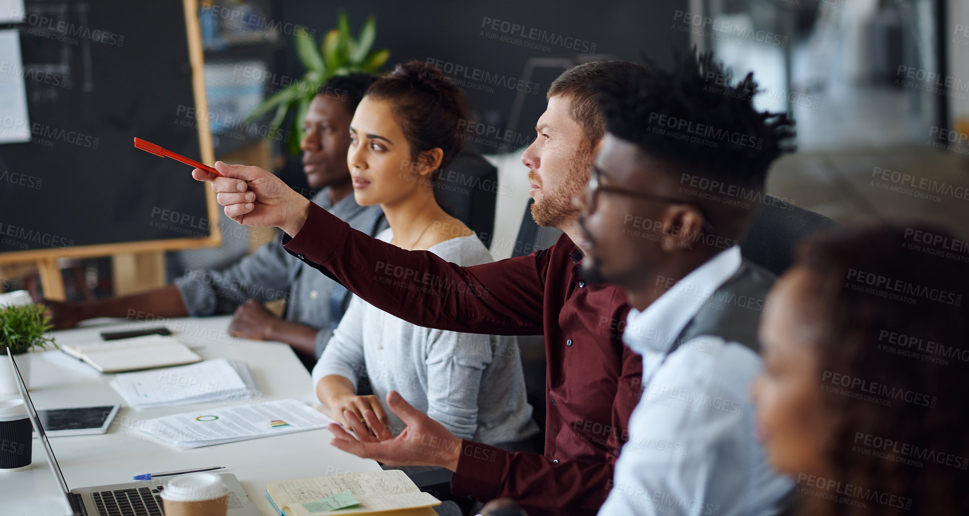 Buy stock photo Shot of a panel of businesspeople giving feedback during a presentation in an office