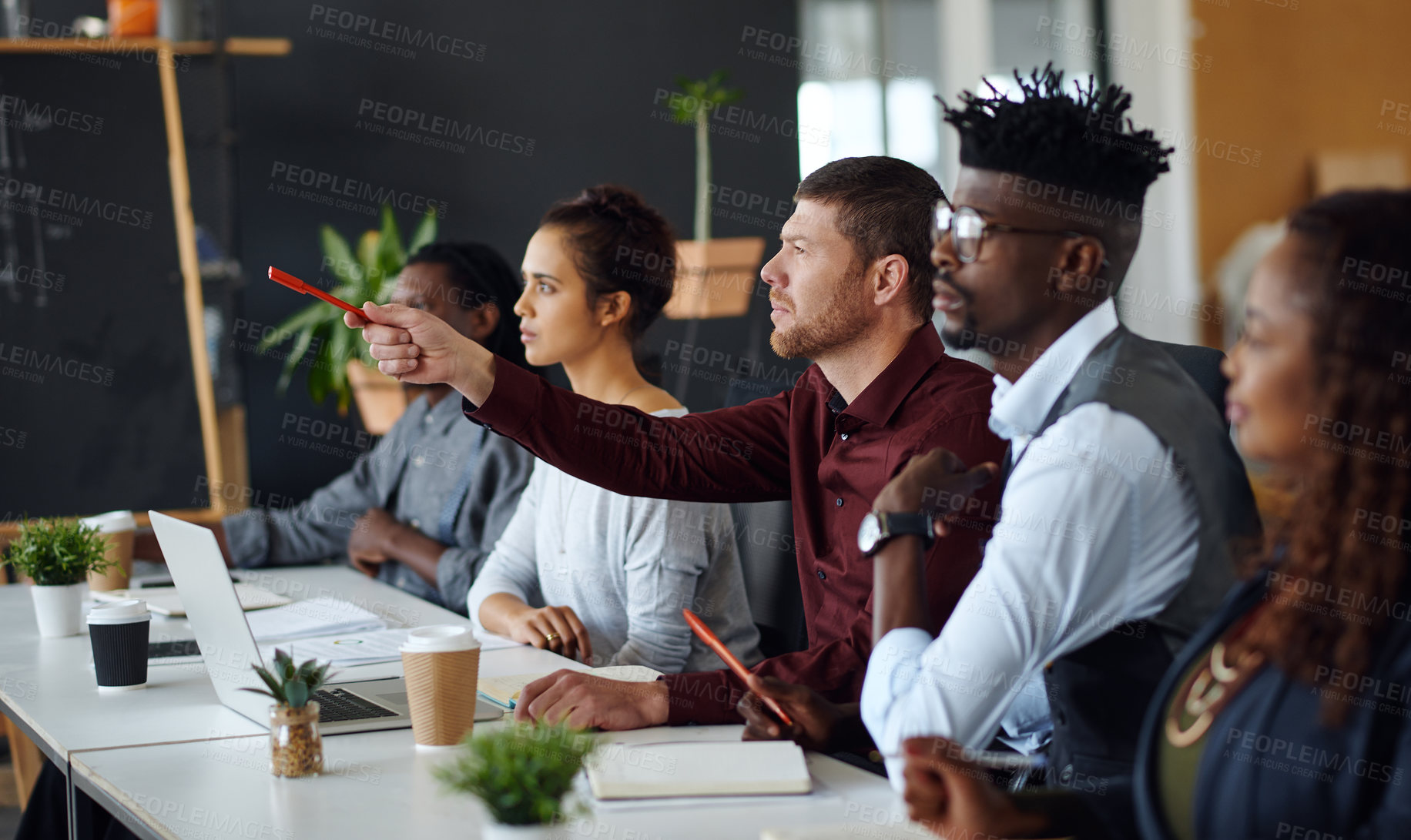 Buy stock photo Shot of a panel of businesspeople giving feedback during a presentation in an office