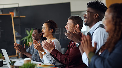Buy stock photo Shot of a group of businesspeople applauding during a presentation in an office