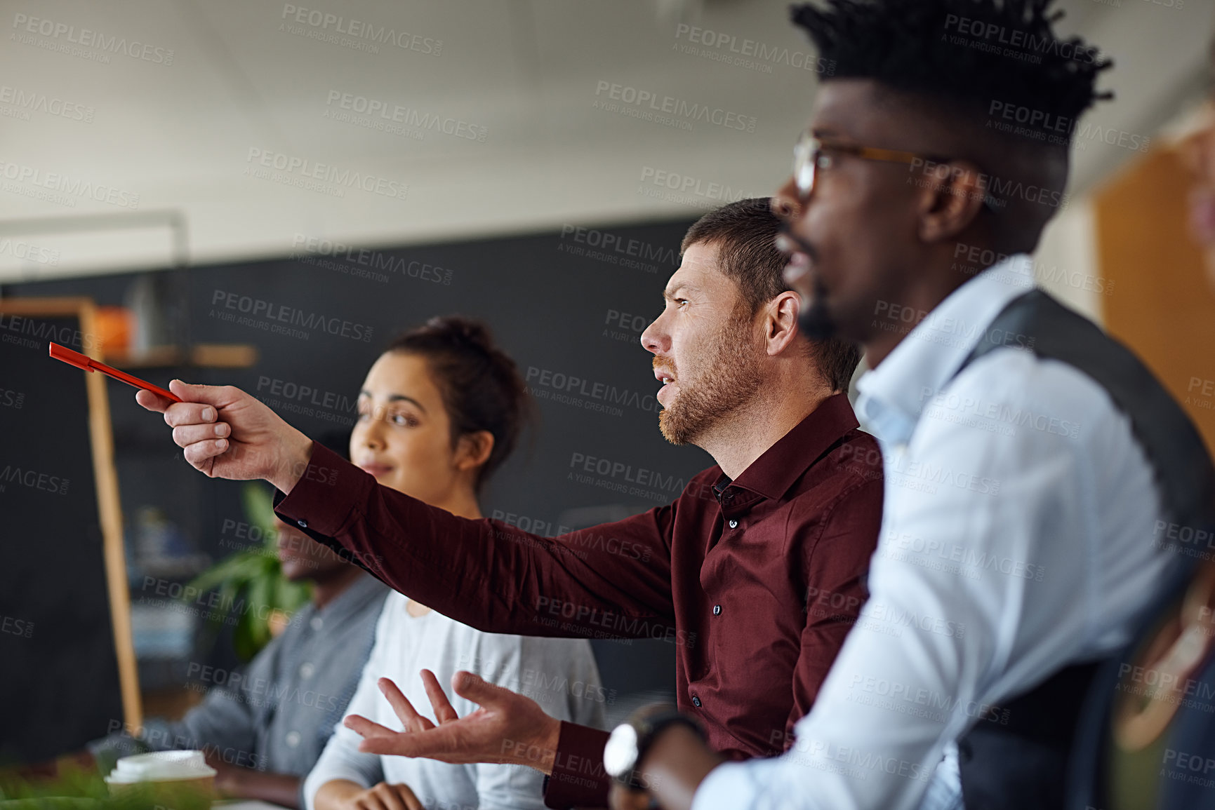 Buy stock photo Shot of a panel of businesspeople giving feedback during a presentation in an office