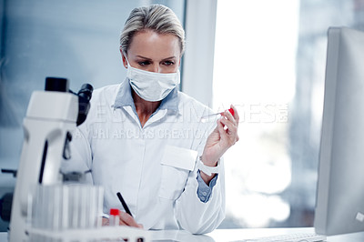Buy stock photo Shot of a mature scientist working in her lab