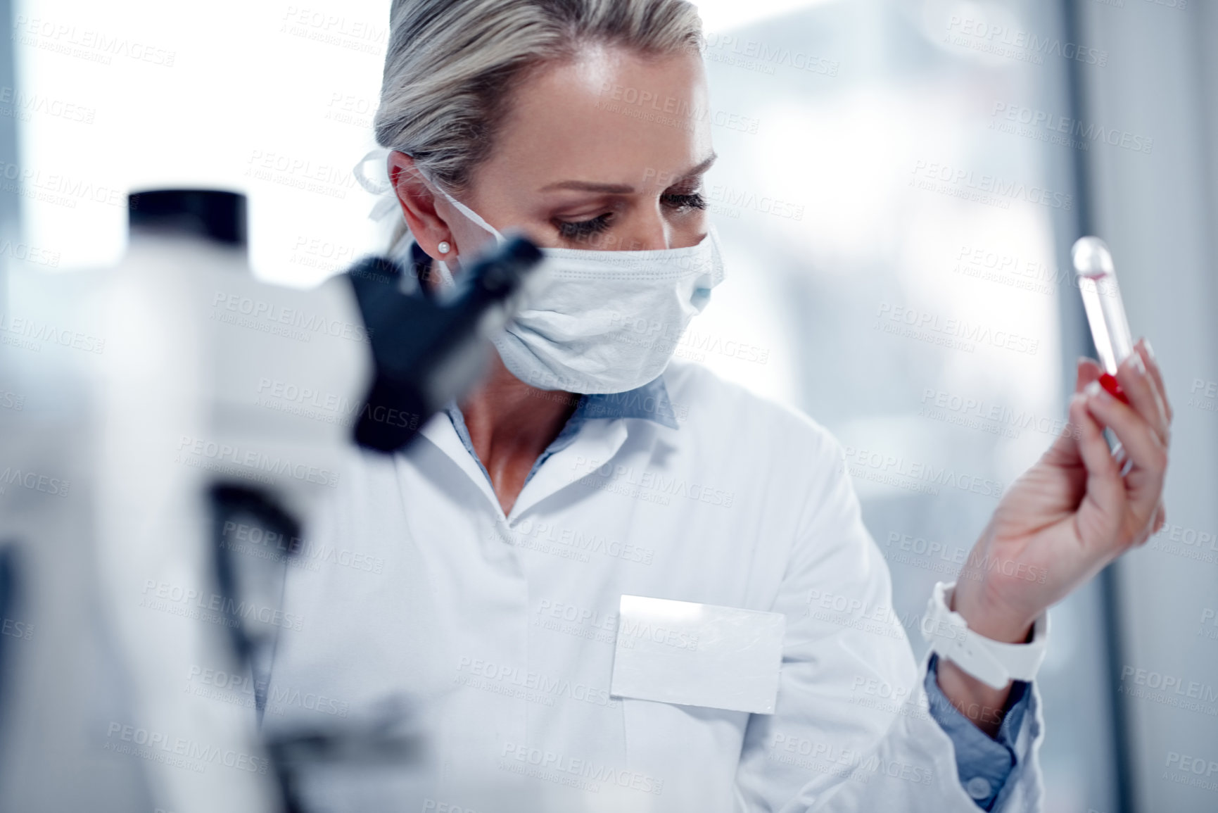 Buy stock photo Shot of a mature scientist working in her lab