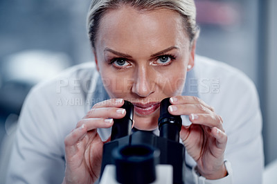 Buy stock photo Portrait of a mature scientist using a microscope in her lab